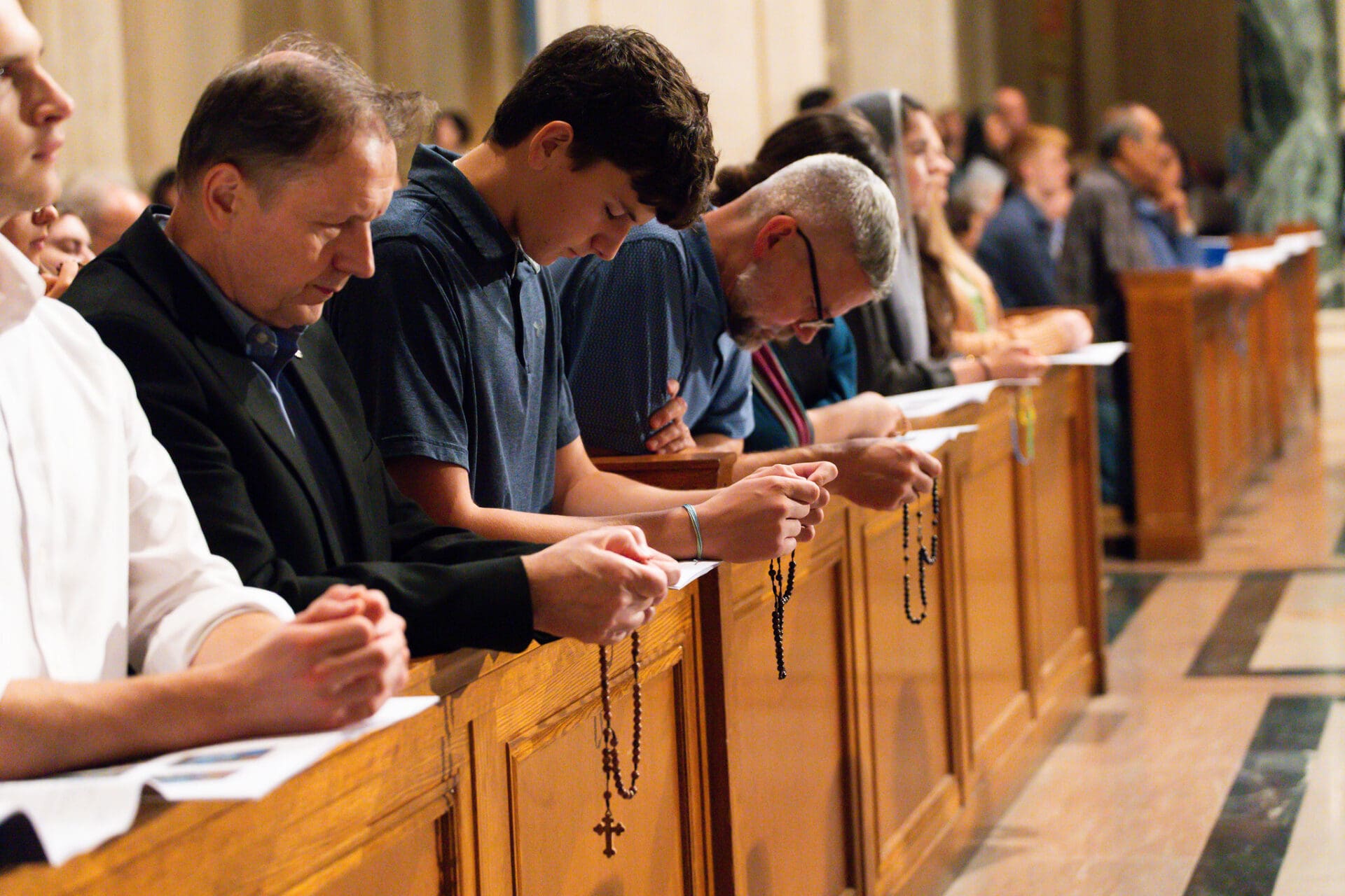 pilgrims praying the Rosary at the 2026 DRP